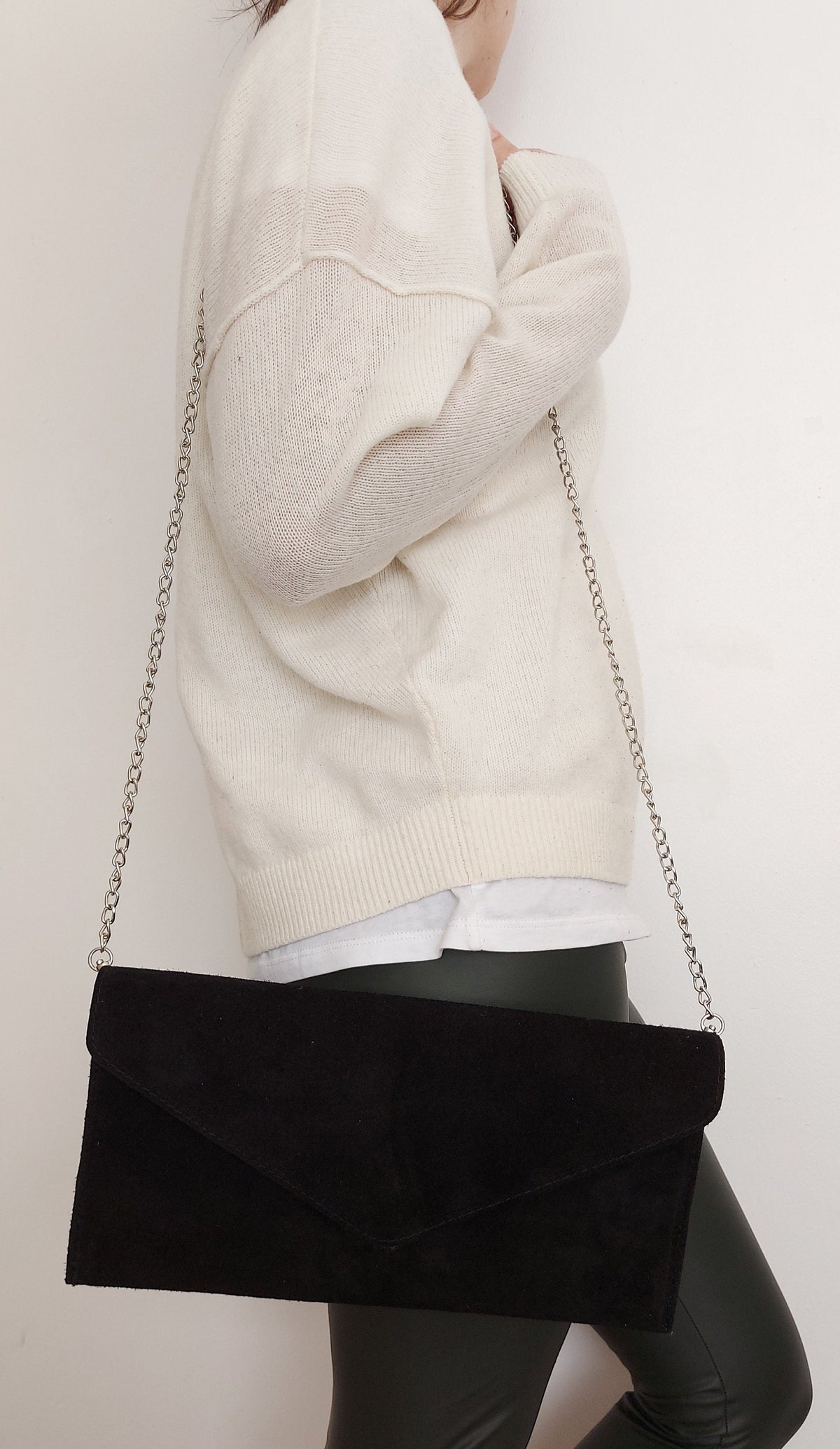 Black envelope clutch bag with chain strap